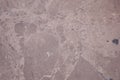 Light burgundy onyx, close-up of polished flat surface of natural stone Royalty Free Stock Photo
