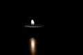 Light candle in the night. Candle flicker. Royalty Free Stock Photo
