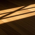 Light casts across a wood floor, creating sharp, geometric shadows. The surface has a Royalty Free Stock Photo