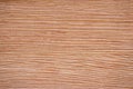 Light cherry flat surface of natural red wood with striped pattern close-up