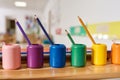 Light class in Montessori kindergarten. The colorful Montessori pencil holders is in the foreground. nobody