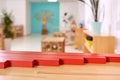 Light class in Montessori kindergarten. The red rods in the foreground. nobody