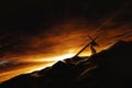 The light and clouds of Golgotha Hill and Jesus Christ carrying the cross of suffering