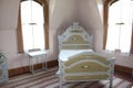 A brightly old-fashioned late 19th century bedroom in a manor home in Sherbrooke village Nova Scotialit Royalty Free Stock Photo