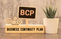 a pen, and a notebook with the text BCP Business Continuity Plan Royalty Free Stock Photo