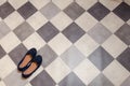 Light and comfortable blue women`s shoes on  black and white checkered floor Royalty Free Stock Photo