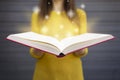 Light coming from book in woman`s hands. Concept of wisdom, reli