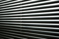 Light coming through closed metallic blinds