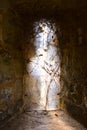 Light coming from an old gothic window of medieval castle, Carisbrooke Castle, Newport, the Isle of Wight, England