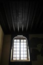 Light coming out of an old wooden window in an old Rashid house