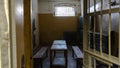 Light Coming in Through Prison Cell Bars Window. Empty Jail Cells. Prison Interior.