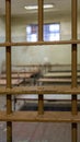 Light Coming in Through Prison Cell Bars Window. Empty Jail Cells. Prison Interior.