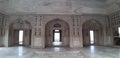 Light coming from three doors of the Agra Fort, India The pillars of the structure encrusted with gems and precious stones.