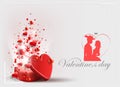 Light composition with a red box with a lot of hearts and a silhouette of a guy in a hat and a girl. Royalty Free Stock Photo