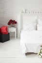 Light cozy room with red boxes and flowers. Royalty Free Stock Photo