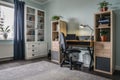 Light cozy teen room with white bookcases and working desk Royalty Free Stock Photo