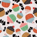 Light cream with cute halloween cupcakes and black bats seamless pattern background design.