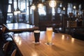 Light and dark beer in glasses on a wooden table in a bar Royalty Free Stock Photo