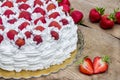 Light, delicate and tasty cream cake with fresh strawberries half cake Royalty Free Stock Photo