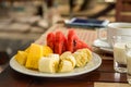 Light dessert fruit plate sliced pieces of fruit watermelon pineapple banana compliment after dinner Royalty Free Stock Photo