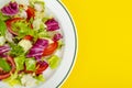 Light dietary vegetarian salad in plate on bright background. Healthy lifestyle concept Royalty Free Stock Photo