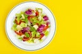 Light dietary vegetarian salad in plate on bright background. Healthy lifestyle concept Royalty Free Stock Photo