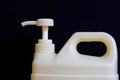 The light dispenser-pump is installed on a plastic canister with a cleaning disinfectant liquid
