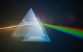 Light dispersion and refraction concept. Light shining through triangular glass prism. 3D rendered illustration