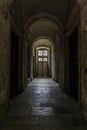 light from the door at the end of the dark tunnel. Inner corridors of a residental building Royalty Free Stock Photo