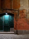 Light door at old building in Rome at night Royalty Free Stock Photo