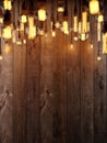 The light from the Edison lamp. Hang on the background of a wooden wall, depth-of-field camera effects.