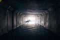 Light at the end of dark flooded sewer tunnel Royalty Free Stock Photo