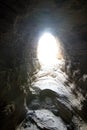 Light at the End of a Dark Rock Tunnel Royalty Free Stock Photo