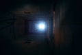 Light in end of old grungy concrete tunnel or tube or corridor, abstract way to hope concept in abandoned scary building Royalty Free Stock Photo