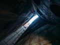 Light in the end of tunnel or corridor of old abandoned NPP with rusty grunge metal or concrete walls