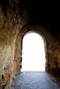light at the end of a tunnel dug into the rock symbol of hope of Royalty Free Stock Photo