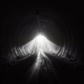 Light at the end of the tunnel. The light penetrates through the end of the dark tunnel