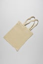 Light fabric eco bag lying on a white background Royalty Free Stock Photo