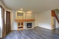 Light filled newly Updated living room interior with traditional fireplace.