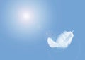 Light fluffy a white feather floating in a blue sky with copy space. Feather abstract freedom concept background Royalty Free Stock Photo