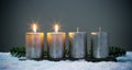 Light four advents candles with matches Royalty Free Stock Photo