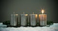 Light four advents candles with matches Royalty Free Stock Photo