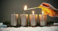 Light four advents candles with matches Royalty Free Stock Photo