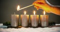 Light four advents candles with matches Royalty Free Stock Photo