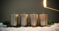 Light four advents candles with matches Royalty Free Stock Photo