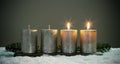 Light four advents candles with matches Royalty Free Stock Photo