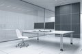 Light futuristic server room office interior with desk and empty computer monitors. Technology, data, innovation and design Royalty Free Stock Photo