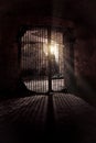 Light glowing from Iron grate in old cellar Royalty Free Stock Photo