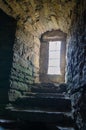 Daylight is going through window to medieval castle underground