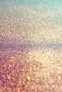 Light Gold glitter texture sparkling paper background. Abstract twinkled glittering background with bokeh, defocused lights for